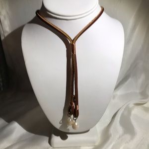 Suede leather Lariat style necklace.